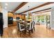 Gourmet kitchen featuring hardwood floors, granite counters, wooden beams, and ample cabinet space at 979 Pathview Ct, Dacula, GA 30019