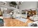 Spacious living room with hardwood floors, a staircase, second story, and open floor plan at 979 Pathview Ct, Dacula, GA 30019