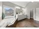 Bright main bathroom featuring a jacuzzi tub, double sinks, and a large window at 979 Pathview Ct, Dacula, GA 30019