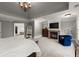 Bright main bedroom featuring a fireplace, TV, ensuite bathroom, and neutral tones at 979 Pathview Ct, Dacula, GA 30019