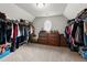 Walk-in closet with ample storage space and carpeted floors at 979 Pathview Ct, Dacula, GA 30019