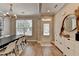 Charming dining room featuring hard wood floors, an elegant chandelier, and a large window at 1203 Penhurst Way, Lawrenceville, GA 30043