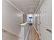Upstairs hallway features a hardwood floor and two large linen closets at 1203 Penhurst Way, Lawrenceville, GA 30043