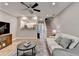 Inviting living room featuring access to the kitchen and staircase at 1203 Penhurst Way, Lawrenceville, GA 30043