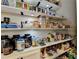 Well-stocked pantry with organized shelves and ample storage space for groceries at 1203 Penhurst Way, Lawrenceville, GA 30043
