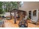 Cozy back deck with gazebo, fire pit, and seating, perfect for outdoor entertaining and relaxation at 155 Redspire Ln, Fayetteville, GA 30215