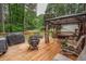 Inviting back deck featuring a gazebo, fire pit, and comfortable seating for enjoying the outdoors at 155 Redspire Ln, Fayetteville, GA 30215