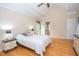 Bright bedroom with ceiling fan and hardwood floors at 155 Redspire Ln, Fayetteville, GA 30215