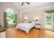 Bedroom featuring a vaulted ceiling and a large arched window at 155 Redspire Ln, Fayetteville, GA 30215