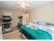 Cozy bedroom featuring a unique white tiger stuffed animal on the bed and exercise equipment in the corner at 155 Redspire Ln, Fayetteville, GA 30215