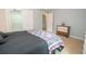 Serene bedroom with comfortable carpet, minimalist furnishings, and a door leading to closet at 155 Redspire Ln, Fayetteville, GA 30215