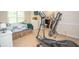 Spacious bedroom with gym equipment and access to office area at 155 Redspire Ln, Fayetteville, GA 30215