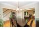 Formal dining room boasts hardwood floors and access to the living room at 155 Redspire Ln, Fayetteville, GA 30215