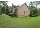 Exterior view of house with lawn, wooden back deck, and mature trees, showing a well-maintained property at 155 Redspire Ln, Fayetteville, GA 30215