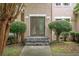 Charming home entrance with stone steps and manicured bushes at 155 Redspire Ln, Fayetteville, GA 30215