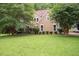 Attractive two-story home surrounded by a lush green lawn at 155 Redspire Ln, Fayetteville, GA 30215