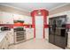 Well-equipped kitchen with white cabinets, stainless steel appliances, and ample counter space at 155 Redspire Ln, Fayetteville, GA 30215