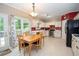 Eat-in kitchen with lots of cabinet space, stainless steel appliances, and a view to the exterior at 155 Redspire Ln, Fayetteville, GA 30215
