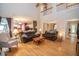 Open living area with hardwood floors, a cozy seating arrangement, and access to the kitchen at 155 Redspire Ln, Fayetteville, GA 30215