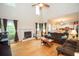 Spacious living room with a fireplace, hardwood floors, and plenty of natural light at 155 Redspire Ln, Fayetteville, GA 30215