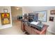 Cozy home office setup with a spacious desk, wall decor and a glimpse into the adjacent bedroom at 155 Redspire Ln, Fayetteville, GA 30215