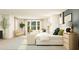Spacious primary bedroom with a king-size bed, sitting area, and bright neutral tones at 252 Deer Valley Run, Canton, GA 30115
