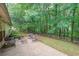 Back patio features outdoor seating and a lovely view of the backyard at 3318 Freedom Lndg, Kennesaw, GA 30144