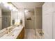 Bathroom featuring stylish vanity with modern fixtures, a separate shower and a bathtub at 3318 Freedom Lndg, Kennesaw, GA 30144
