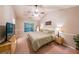Cozy bedroom boasting a serene ambiance with a large window offering natural light and a ceiling fan at 3318 Freedom Lndg, Kennesaw, GA 30144