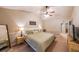 Comfortable bedroom showing a large window with view of the exterior; ceiling fan and side tables at 3318 Freedom Lndg, Kennesaw, GA 30144