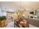 Inviting living room featuring an open layout with dining area and updated kitchen with stainless steel appliances at 3318 Freedom Lndg, Kennesaw, GA 30144