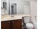 This bathroom features a single vanity, a large mirror, and a shower-tub combo at 3448 Great Meadows Ct, Lithonia, GA 30038