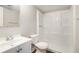 This bathroom features a single vanity and a shower-tub combo with white tiling at 3448 Great Meadows Ct, Lithonia, GA 30038