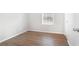 This bedroom features updated flooring and a window for natural light at 3448 Great Meadows Ct, Lithonia, GA 30038