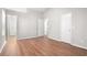 Bedroom featuring wood floors, neutral walls, and two closets at 3448 Great Meadows Ct, Lithonia, GA 30038