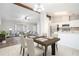 The living room features an open floorplan, views of the kitchen, and a dining area at 3448 Great Meadows Ct, Lithonia, GA 30038