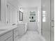 Bathroom featuring dual vanities, a glass shower, and marble floors at 709 Dodd Ln # 165, Buford, GA 30518
