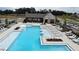 Community pool with lounge chairs and sun decks offers a perfect place to relax and enjoy the outdoors at 709 Dodd Ln # 165, Buford, GA 30518