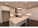 Contemporary kitchen with a large island, stainless steel range hood, and ample cabinet space at 709 Dodd Ln # 165, Buford, GA 30518