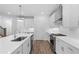 Well-lit kitchen with stainless steel appliances, white cabinets, subway tile backsplash and a large island at 709 Dodd Ln # 165, Buford, GA 30518