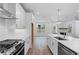 Modern kitchen features stainless steel appliances, white subway tile backsplash, and quartz countertops at 709 Dodd Ln # 165, Buford, GA 30518