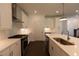 Modern kitchen featuring stainless steel appliances, a gas range, and a stylish island at 709 Dodd Ln # 165, Buford, GA 30518