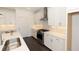 Modern kitchen featuring stainless gas range, white cabinets, and flowing counterspace at 709 Dodd Ln # 165, Buford, GA 30518