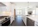 Open kitchen concept featuring stainless appliances, gas range, and flowing living spaces at 709 Dodd Ln # 165, Buford, GA 30518