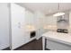 Bright kitchen showcasing white cabinets, stainless steel appliances, and built-in microwave at 709 Dodd Ln # 165, Buford, GA 30518