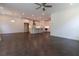 Spacious open floor plan with hardwood floors, ceiling fan, recessed lighting, and a modern kitchen at 709 Dodd Ln # 165, Buford, GA 30518