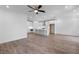 Open-concept living room and kitchen with hardwood floors at 709 Dodd Ln # 165, Buford, GA 30518
