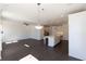 Bright living room with open kitchen, hardwood floors, recessed lighting, and ceiling fan at 709 Dodd Ln # 165, Buford, GA 30518