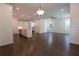 Open floor plan with hardwood floors, large windows and a kitchen island at 709 Dodd Ln # 165, Buford, GA 30518