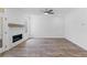 Spacious living room features a fireplace and ample natural light from the windows and glass door at 709 Dodd Ln # 165, Buford, GA 30518